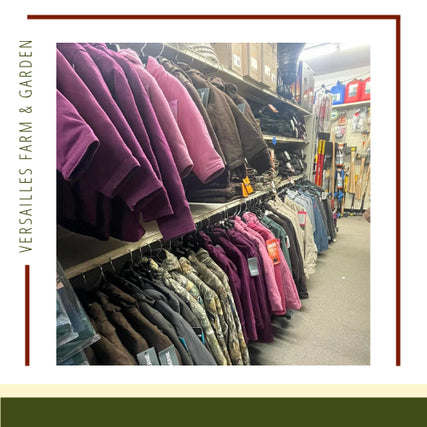 Clothing & ApparelJackets in various colors, including purple and camouflage, are neatly hung in rows inside a store. Shelves with products line the walls. A calm, organized atmosphere.